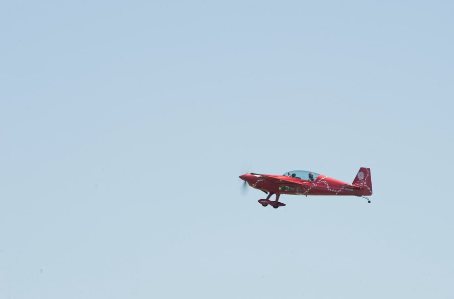 Jacquie Warda, known as Jacquie B, takes Airman 1st Class Antonio Gonzalez, 2nd Bomb Wing Public Affairs, for a ride over Shreveport, La., April 19. Gonzalez recorded his flight with Jacquie B to post on social media and document a low-level aerobatics performance in her Pitts Special biplane. Jacquie B will be one of many performers at the 2012 Barksdale Air Force Base Defenders of Liberty Air Show April 21-22. (U.S. Air Force photo/Airman 1st Class Benjamin Gonsier)(RELEASED)
