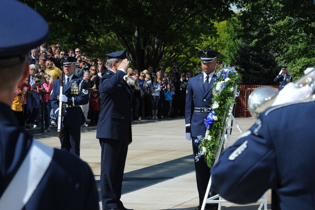 Technical Sgts. Brian Mann and Matt Misener perform "Muffled Ruffles" and "Taps" at a wreath laying ceremony at the Tomb of the Unknowns (photo by Technical Sgt. Raymond Mills)
