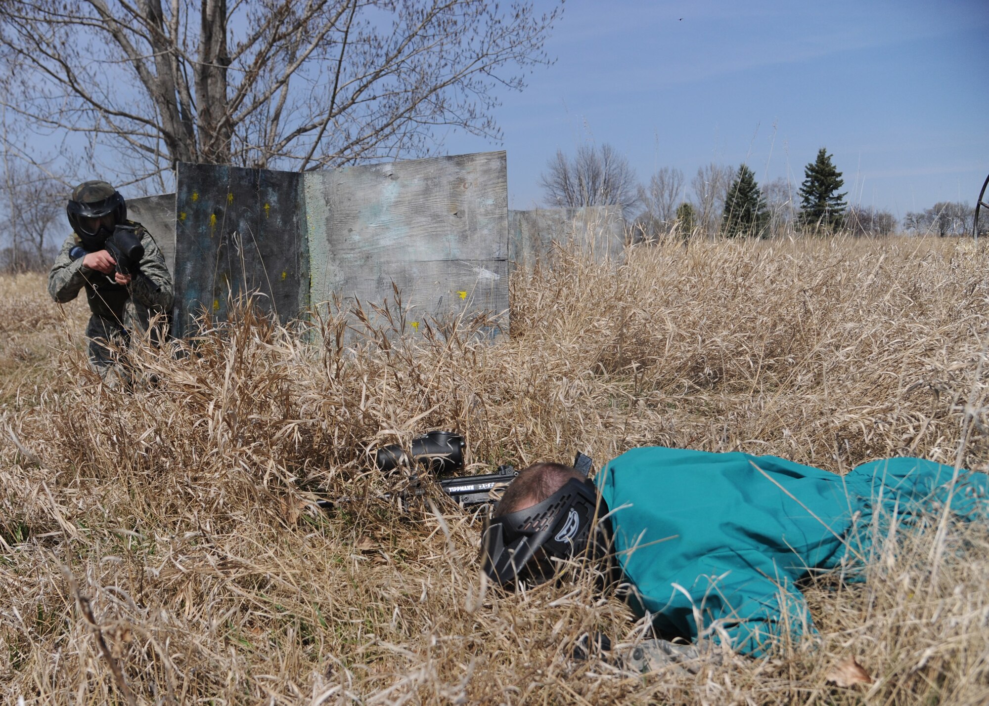 (From left) Senior Airman Bryce Prellwitz, 319th Civil Engineering Squadron, simulates apprehending a subject during augmentee training  April 13, 2012, on Grand Forks Air Force Base, N.D.  (U.S. Air Force photo by Senior Airman Amber Bennett).