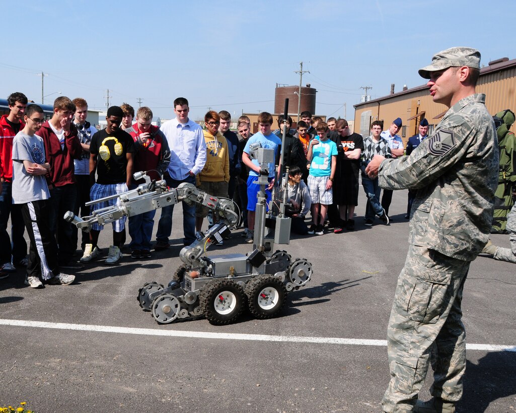 Master Sgt. Keith Hartloff, 914th Airlift Wing Explosive Ordinance Disposal Superintendant explains to a group of students the capabilities and roles the F6A Robot plays in Air Force EOD at the Niagara Falls Air Reserve Station on April 19, 2012. The Williamsville East High School students were on a tour of the installation. Air Force recruiters were on hand to help answer any questions about Air Force careers. (US Air Force photo by Peter Borys)
