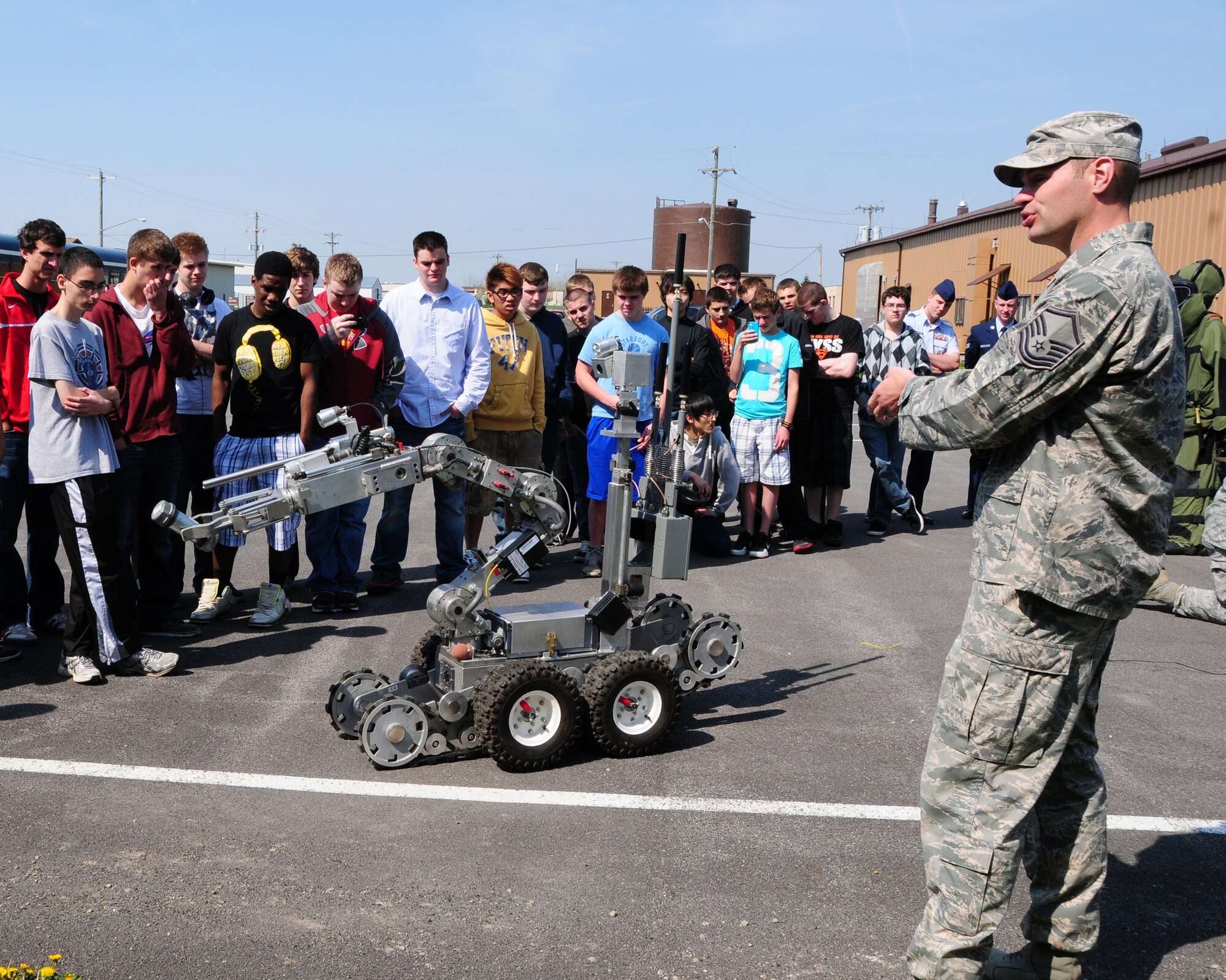 Master Sgt. Keith Hartloff, 914th Airlift Wing Explosive Ordinance Disposal Superintendant explains to a group of students the capabilities and roles the F6A Robot plays in Air Force EOD at the Niagara Falls Air Reserve Station on April 19, 2012. The Williamsville East High School students were on a tour of the installation. Air Force recruiters were on hand to help answer any questions about Air Force careers. (US Air Force photo by Peter Borys)