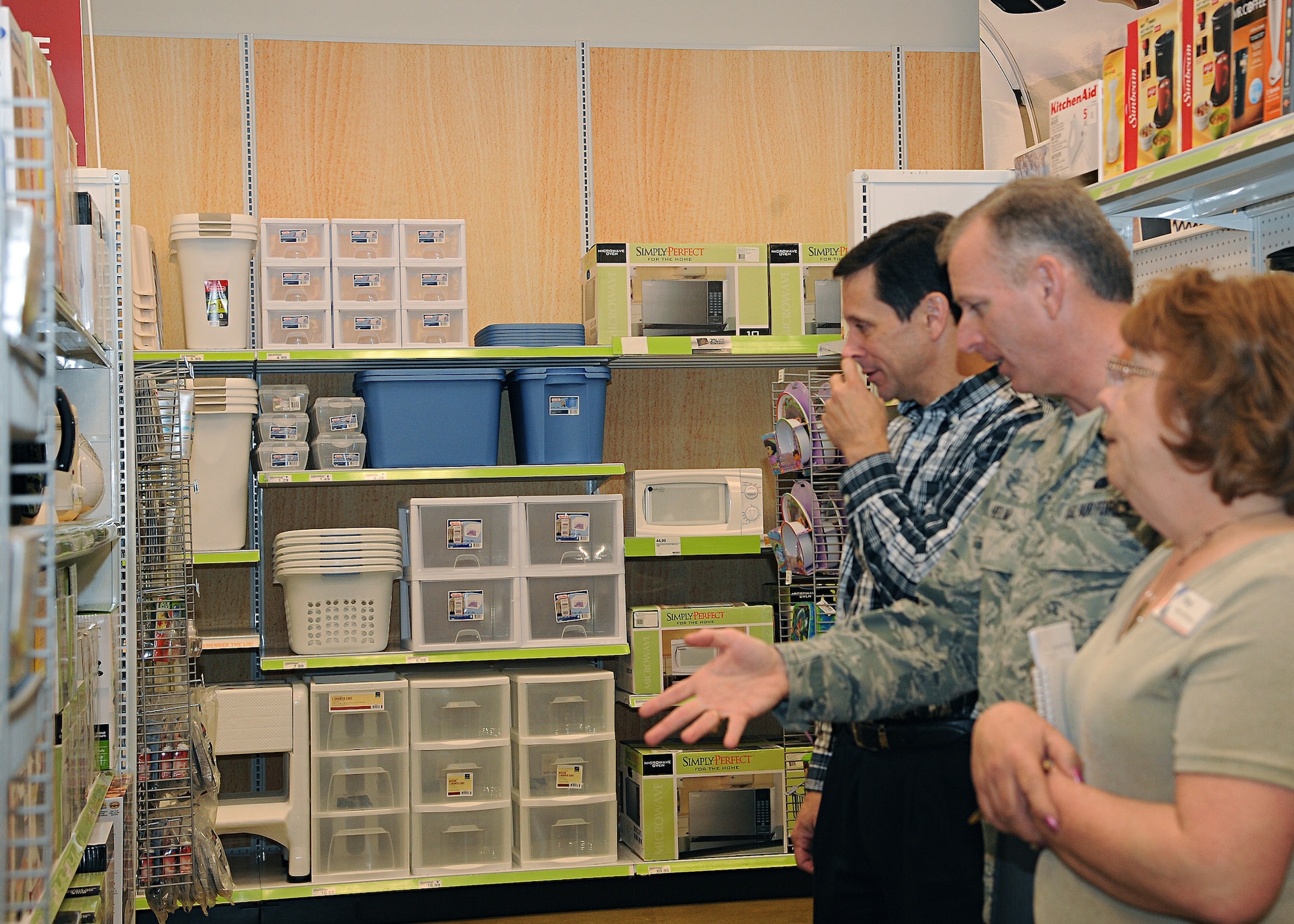 Chief Master Sgt. Jeffry Helm, senior enlisted advisor for the Army & Air Force Exchange Service, visits the Base Exchange on April 19, 2012, on Grand Forks Air Force Base, N.D., alongside Store Manager Pat Fields, right, and Area Manager Daniel Schmitz, left. Helm toured Exchange facilities, plus met with employees and addressed Exchange-related issues here. (U.S. Air Force photo/Senior Airman Amber Bennett)