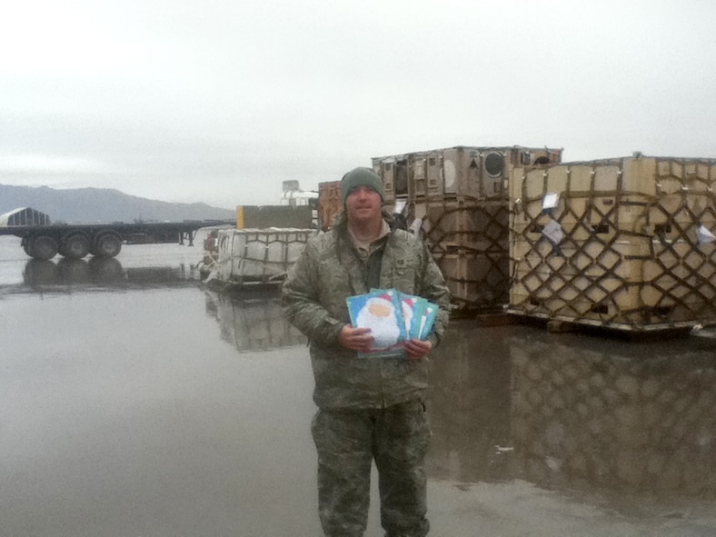 Tech Sgt. Timothy Hageny, an Airman assigned to the 167th Airlift Wing’s Logistics Readiness Squadron, shows some letters he received from fifth-graders at Warm Springs Intermediate School in Berkeley Springs, W.Va. Fellow Airmen deployed from the 167th Airlift Wing assisted Hageny in responding to the letters. 