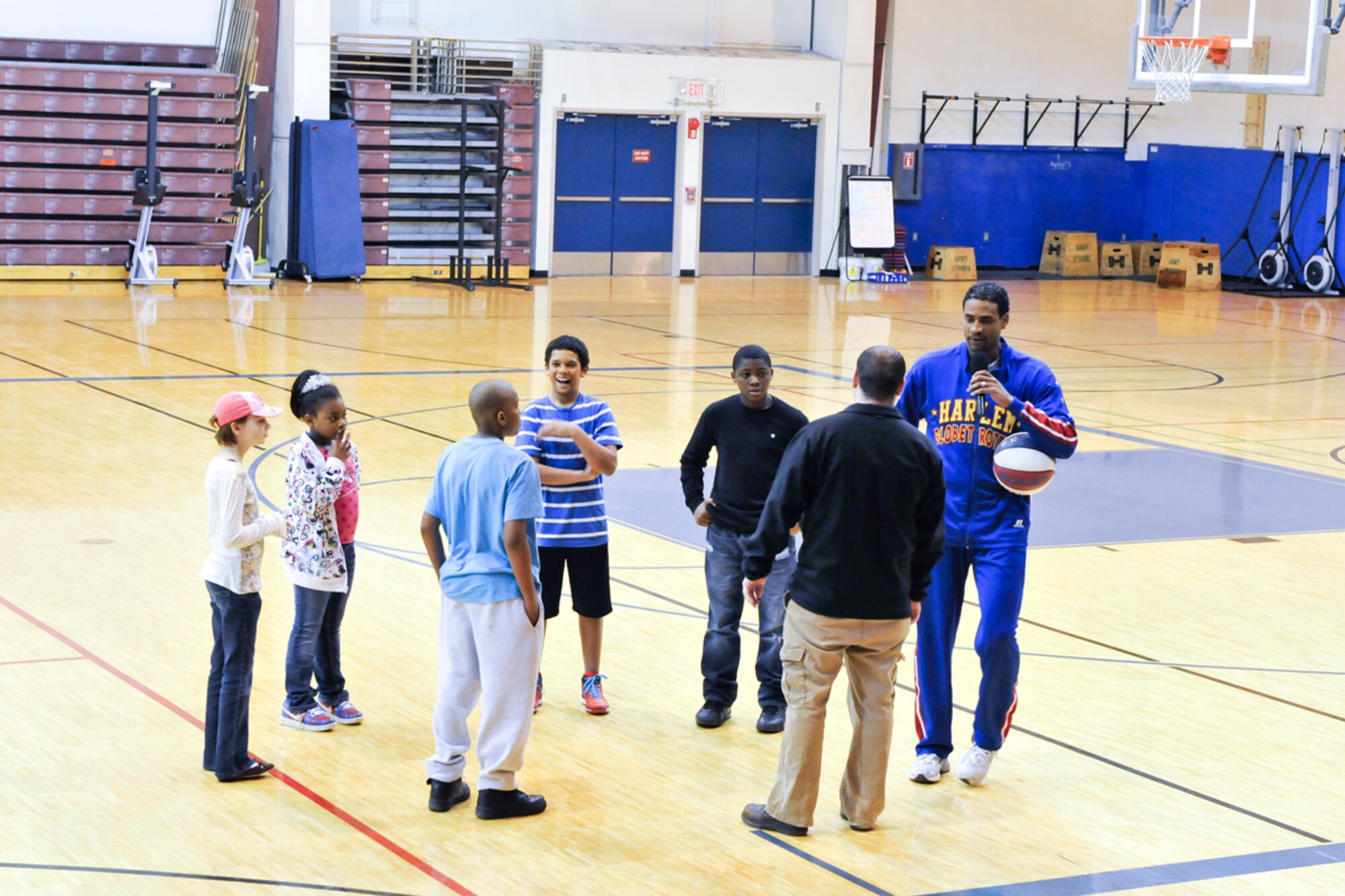 JOINT BASE ELMENDORF-RICHARDSON,Alaska-Wun Versher,"The Shot", Harlem Globe Trotters team member, assisted by volunteers from the audiance gave a  demonstration was at the Buckner Fitness Center on Joint Base Elmendorf-Richardson on 17 April 2012. It was followed by a autograph and photo session. (USAF Photo by Steven White/JBER/PA)