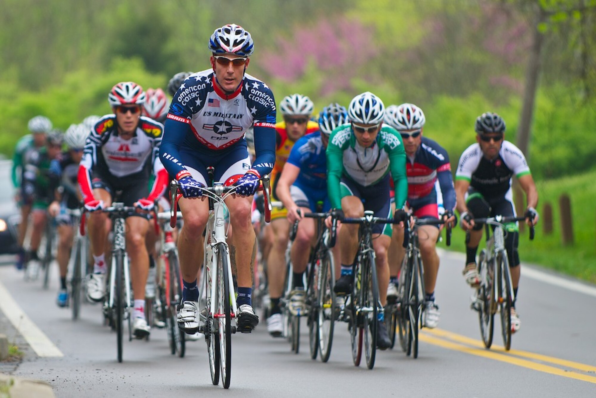 Capt. Jason Peterson, 571st Mobiliity Support Advisory Squadron strategy and plans flight commander rides with his team during a previous competitive cycling race. (courtesy photo)