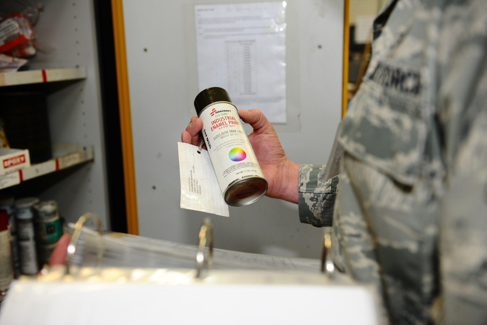 SPANGDAHLEM AIR BASE, Germany – Master Sgt. Chad Haughenbury, U.S. Air Forces in Europe hazardous materials manager, checks an aerosol paint can for correct material saftey data sheet labeling during an Environmental, Safety and Occupational Health Compliance Assessment Management Program evaluation inside the jet propulsion maintenance shop here April 18. The week-long ESOHCAMP assessment gives the base an idea of how its compares to U. S. Air Force and host-nation regulations regarding environmental and occupational safety. This team is made up of 15 USAFE evaluators who assess Spangdahlem AB’s overall health. The base uses the results from the program to help become USAFE’s most environmentally friendly wing. (U.S. Air Force photo by Airman 1st Class Dillon Davis/Released)