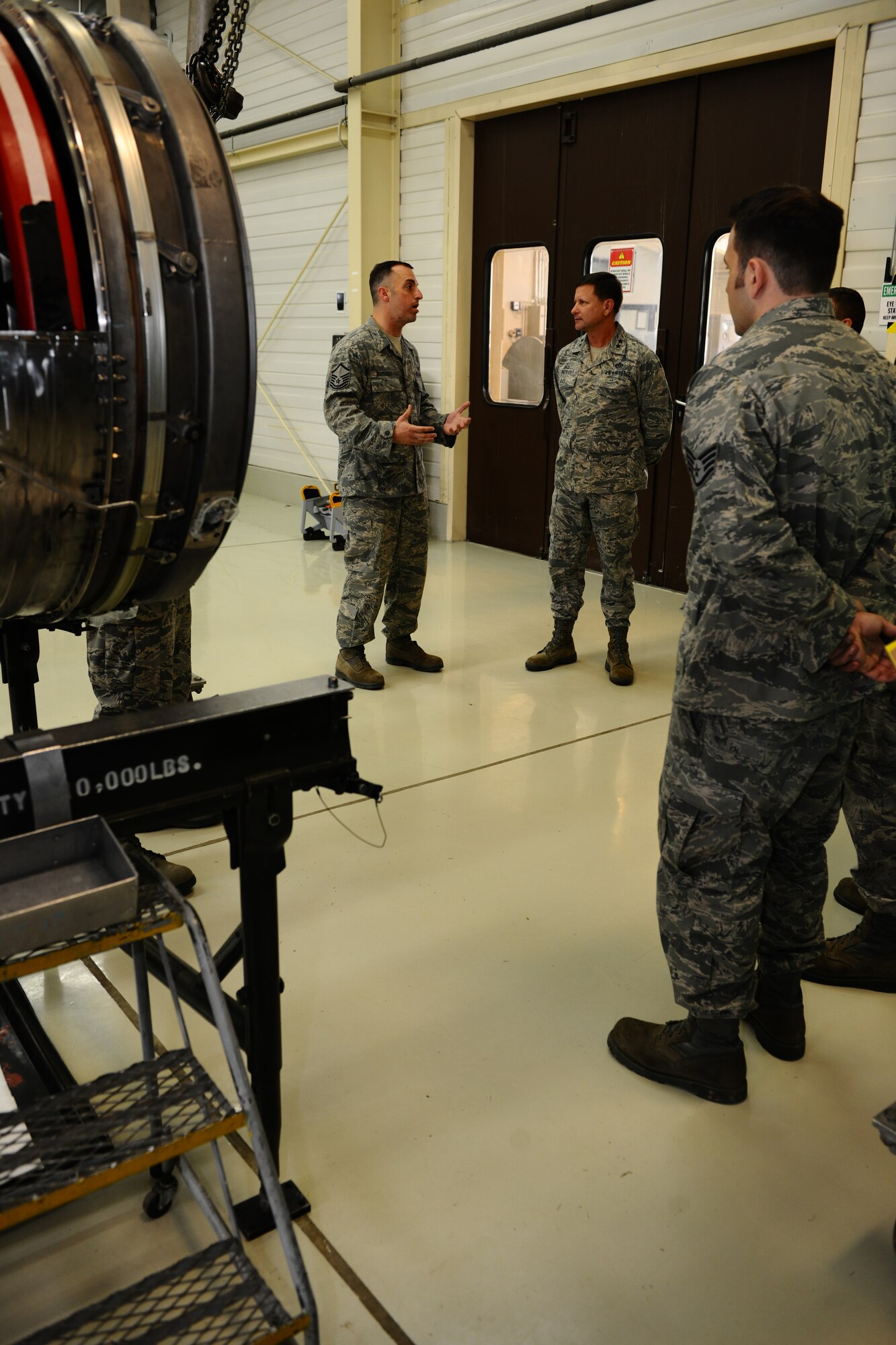 SPANGDAHLEM AIR BASE, Germany – Master Sgt. Steven Bousquet, 372nd Training Squadron Detachment 2 jet propulsions maintenance training instructor, explains how instructor-guided training expands maintainers’ knowledge to Maj. Gen. Leonard Patrick, 2nd Air Force commander, during a tour of 372nd TRS Det 2 classrooms and training facilities inside Bldg. 43 here April 18. Patrick and Chief Master Sgt. Oscar Mackin, 2nd AF command chief, visited the 372nd TRS Det 2 during their 2nd AF overseas units tour. The detachment offers advanced skills using classroom and hands-on training on the F-16 Fighting Falcon and A-10 Thunderbolt II for more than eight different aircraft maintenance career fields. (U.S. Air Force photo by Airman 1st Class Dillon Davis/Released)
