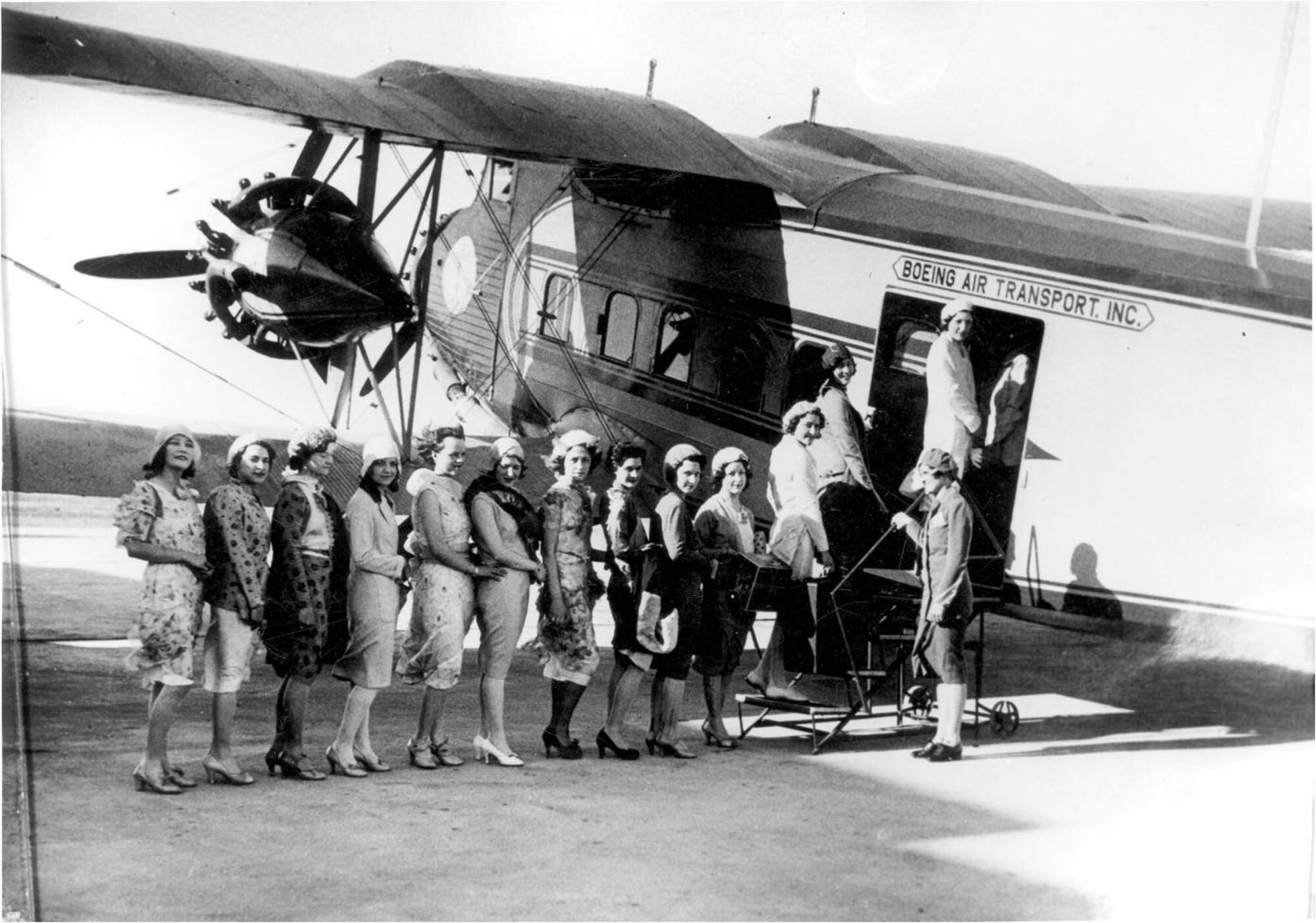 A group of stewardesses board a plane in the early days of training in Cheyenne, Wyo. (Photo courtesy of Michael Kassel)