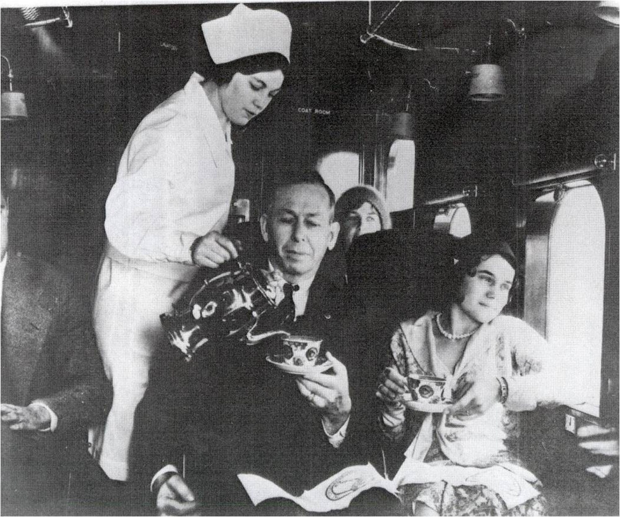 A stewardess serves a passenger on a flight in the early days of the stewardess program in Cheyenne, Wyo. (Image courtesty of Wyoming State Archives) 
