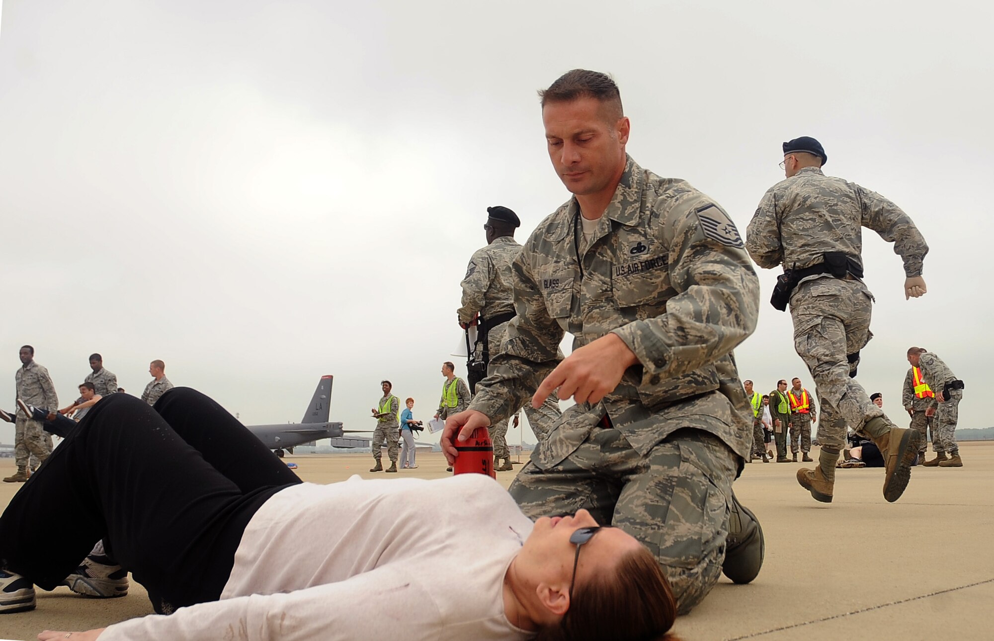 Barksdale Airmen respond to simulated victims during a Major Accident Response Exercise on Barksdale Air Force Base, La., April 13. More than 50 Barksdale Airmen were moulaged for the exercise, assisting exercise evaluation team members in evaluating how medical, security forces and several base and community emergency services responded to the incident. (U.S. Air Force photo/Staff Sgt. Amber Ashcraft) (RELEASED)