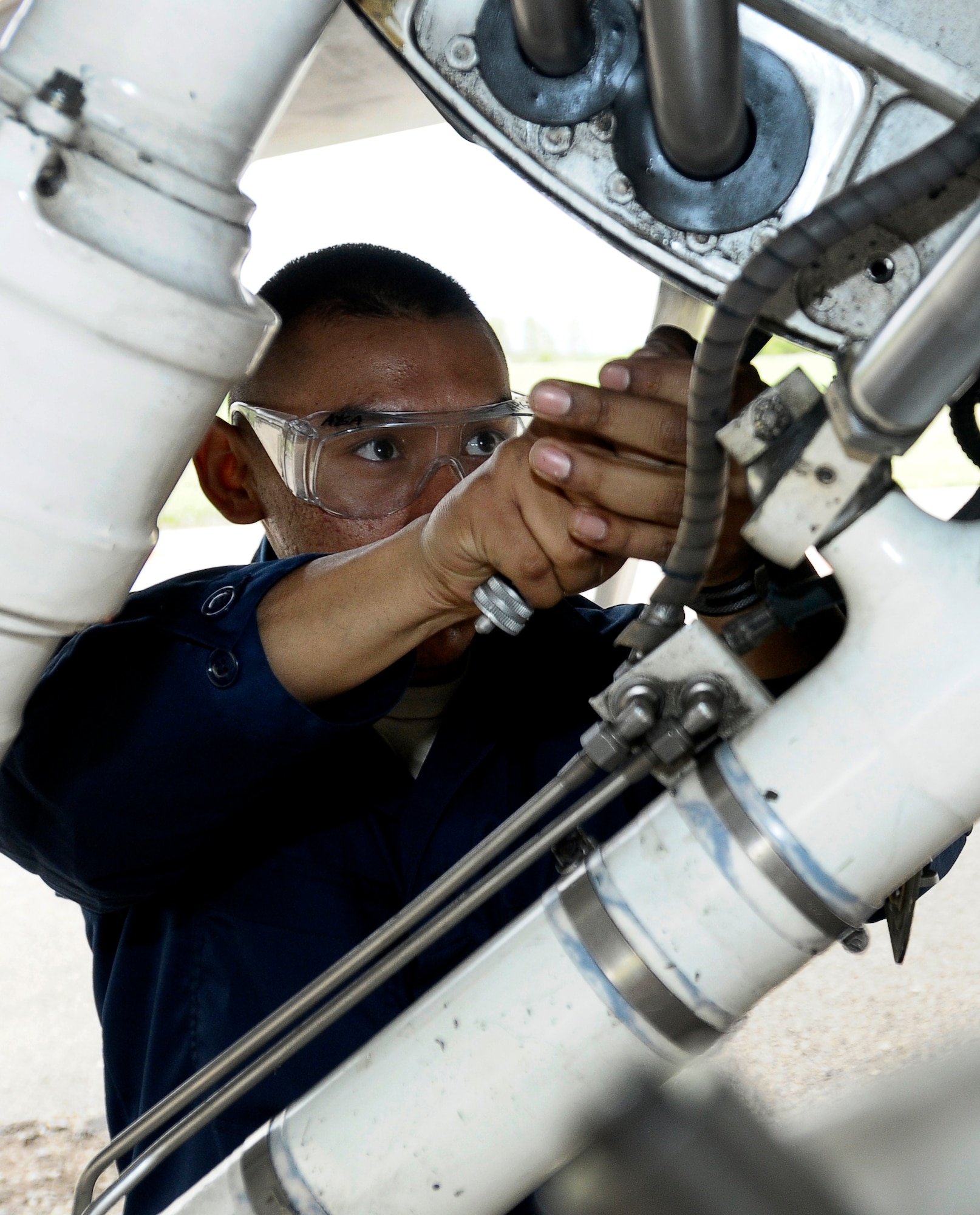 GRAF IGNATIEVO AIR FORCE BASE, Bulgaria -- Airman 1st Class Angel Guerrero, 31st Maintenance Squadron crew chief, performs post-flight maintenance on an F-16 after landing here April 17, 2012. Graf Ignatievo is now host to more than two dozen F-16 Fighting Falcons and more than 500 U.S. Air Force personnel in support of Thracian Star 2012, a month-long joint training exercise focused on building partnerships and increasing interoperability with the Bulgarian pilots, maintainers, joint terminal air controllers, firefighters and security forces Airmen. (U.S. Air Force photo/Senior Airman Katherine Windish)
