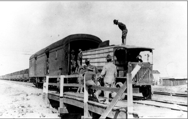 Members of the 1st Aero Squadron transfer a crated airplane from a rail car to truck in Columbus N.M., March 1916. (Contributed photo)