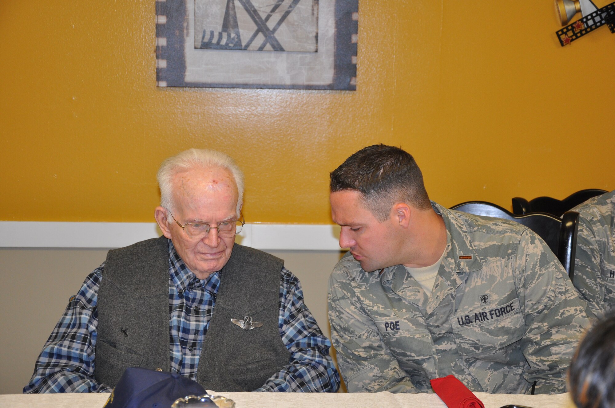 SAN ANGELO, Texas-  2nd Lt. Steven Poe, 17th Medical Group talks to Harold Anderson, a veteran at Meadow Creek Nursing Home. The veterans shared their past experiences with the officers. Among the veterans was a retired Air Force intelligence specialist from Goodfellow, and a pilot who still proudly wore his wings. (U.S. Air Force photo/2nd Lt. Leanne Caballer)   
