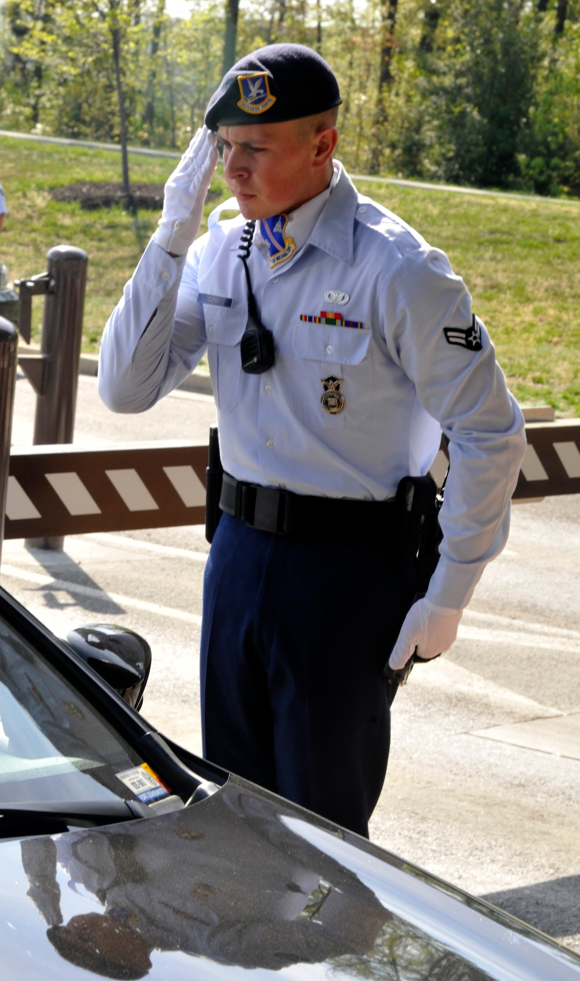 Airman 1st Class Robert Dorsey, Andrews Elite Gate Guard, snaps a salute April 16 while checking IDs at the Andrews Main Gate. Dorsey is one of 63 members of the Andrews Elite Gate Guard; the first of its kind at Andrews. (U.S. Air Force photo/Airman 1st Class Lindsey A. Porter) 