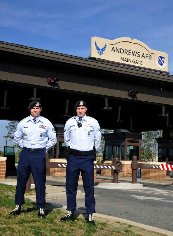Elite Gate Guards Tech. Sgt. Scott Gero and Airman 1st Class Blake Miller pose in front of the Joint Base Andrews Main Gate April 16. Differences between Elite Gate Guards and Andrews’ original gate guards include a revamped uniform and higher standards of performance. (U.S. Air Force Photo/Airman 1st Class Lindsey A. Porter)  