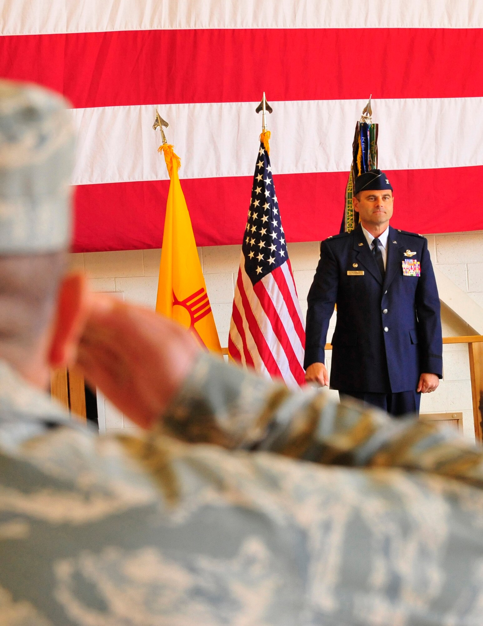 Members of the 44th Fighter Group saluted a new commander, Col. Kent Furman, at a change of command ceremony at Holloman Air Force Base, NM April 15. (U.S. Air Force photo/SrA Martha Whipple)