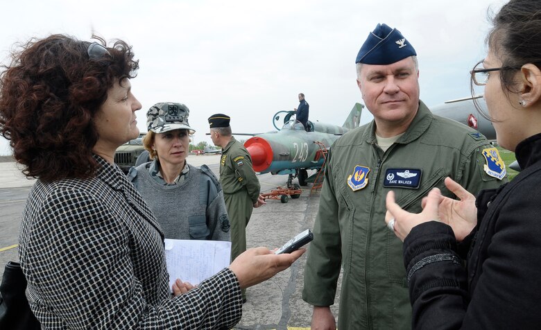 GRAF IGNATIEVO AIR FORCE BASE, Bulgaria -- Col. David Walker, 31st Operations Group and Thracian Star 2012 detachment commander, speaks to a journalist from the Bulgarian Telegraph Agency through a translator April 18, 2012 during the opening ceremony for the month-long joint training exercise focused on building partnerships and increasing interoperability with the Bulgarian air force. Bulgarian and American senior officials took the opportunity to acknowledge and express appreciation for the long-standing partnership between the two nations. (U.S. Air Force photo/Senior Airman Katherine Windish)