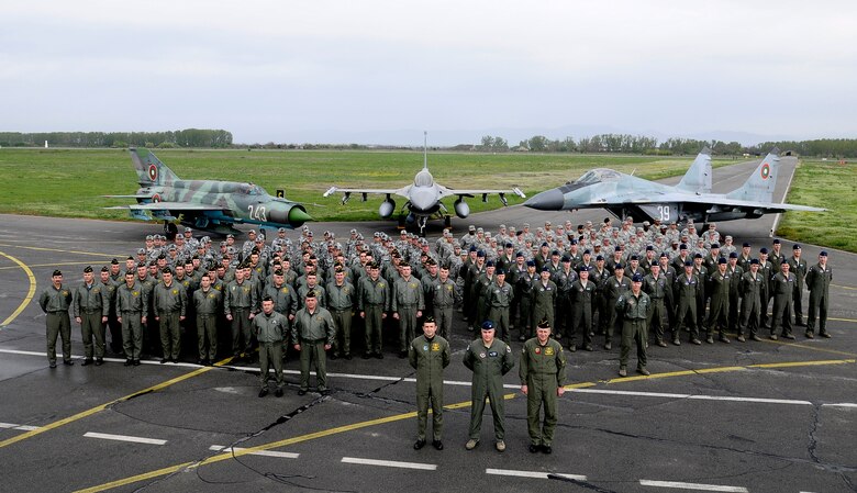 GRAF IGNATIEVO AIR FORCE BASE, Bulgaria -- Members of the 31st Fighter Wing and the Bulgarian air force pose for a group photo in front of an American F-16 and a Bulgarian MiG-21 and MiG-29 aircraft following the opening ceremony for Thracian Star 2012, April 18, 2012. Thracian Star 2012 is a month-long joint training exercise focused on building partnerships and increasing interoperability with the Bulgarian air force. While this is not the first time the Bulgarian air force has hosted American forces at Graf Ignatievo, Thracian Star 2012 boasts the largest contingent of Airmen to date they’ve hosted.  In all, the 31st FW brought more than two dozen F-16 Fighting Falcons and more than 500 Airmen—about twice the amount than any other U.S. Air Forces in Europe wing thus far. (U.S. Air Force photo/Senior Airman Katherine Windish)