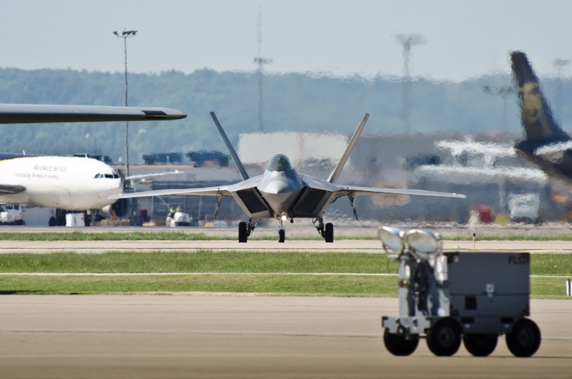 A U.S. Air Force F-22 Raptor aircraft taxies into the Kentucky Air National Guard Base in Louisville, Ky., on April 18, 2012, prior to this weekend's 22nd annual Thunder Over Louisville air show. The Raptor is the U.S. military's premier fighter aircraft, with capabilities that are unmatched by any other plane. (U.S. Air Force Photo by Maj. Dale Greer)