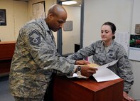 Senior Master Sgt. Jonathon Curl, Pacific Air Force Inspector General team member, goes over some final details with Senior Airman Leah Novich, 8th Logistics Readiness Squadron quality assurance inspector, on Kunsan Air Base, Republic of Korea, April 19, 2012. Inspectors evaluate each unit's execution of Headquarters Air Force, major command, local checklists and overall historical data of program management. (U.S. Air Force photo/Senior Airman Jessica Hines)