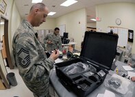 Senior Master Sgt. Michael Hudson, Pacific Air Force Inspector General team member, checks a piece of aircrew chemical defense equipment from the 8th Operations Support Squadron on Kunsan Air Base, Republic of Korea, April 19, 2012. As part of the Consolidated Unit Inspection, PACAF IG members examine processes, equipment and compliance with Air Force standards. (U.S. Air Force photo/Senior Airman Jessica Hines) 