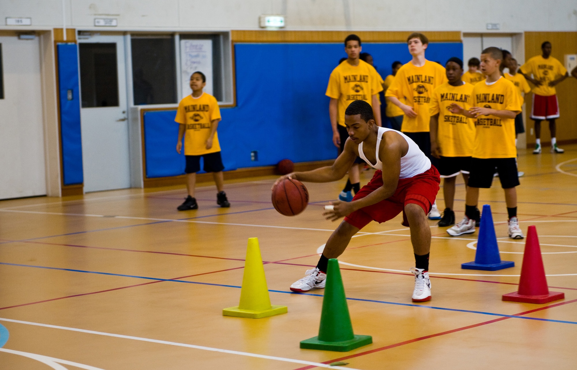 YOKOTA AIR BASE, Japan -- A camp participant dribbles in between cones during the Mainland Basketball Camp at Yokota Air Base, Japan, April 11, 2012. The camp was held from April 9-13. (U.S. Air Force photo/Airman 1st Class Krystal M. Garrett)  