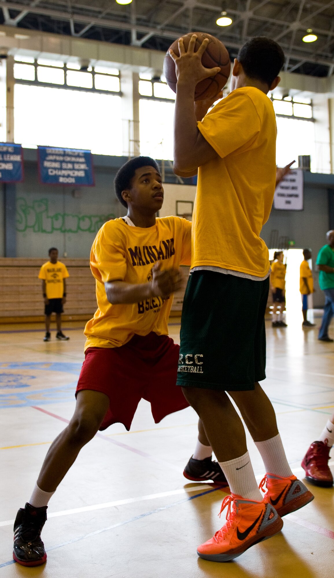 YOKOTA AIR BASE, Japan -- Mainland Basketball Camp participants practice defensive skills during a five day camp held at Yokota Air Base, Japan, April 11, 2012. The camp focused on strengthening basic fundamentals of basketball. (U.S. Air Force photo/Airman 1st Class Krystal M. Garrett)  
