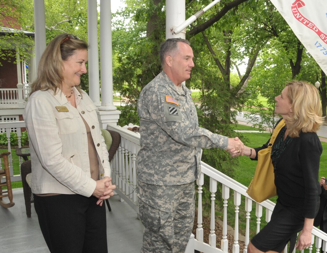 Maj. Gen. William Grimsley, Chief of Staff, U.S. Strategic Command, and his wife, Mrs. Jan Grimsley, greet a member of the Omaha Executive Institute program April 19, 2012 at Officers Quarters 13 on the historic General&#039;s Row housing area. USSTRATCOM hosted the OEI program, a Greater Omaha Chamber of Commerce sponsored event, to increase understanding of  command missions.