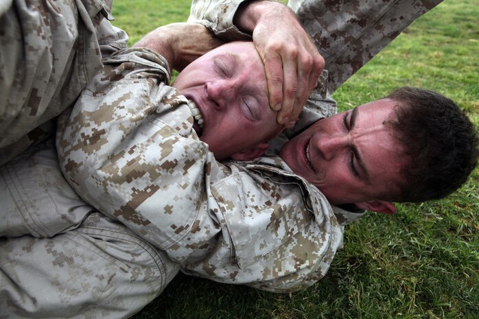 Lance Cpl. Kyle Scales, a fire team leader, grapples Lance Cpl. James Rounds, a rifleman, while other Marines from Charlie Company, Battalion Landing Team 1st Battalion, 2nd Marine Regiment, 24th Marine Expeditionary Unit, pin Rounds' arms and legs here, April 19, 2012, during a squad vs. squad Marine Corps Martial Arts Program grappling exercise. The Marines spent the day engaging in a variety of training events before enjoying a much needed day off in Spain. The 24th MEU, partnered with the Navy's Iwo Jima Amphibious Ready Group, is currently deployed as a theater reserve and crisis response force capable of a variety of missions from full-scale combat operations to humanitarian assistance and disaster relief.