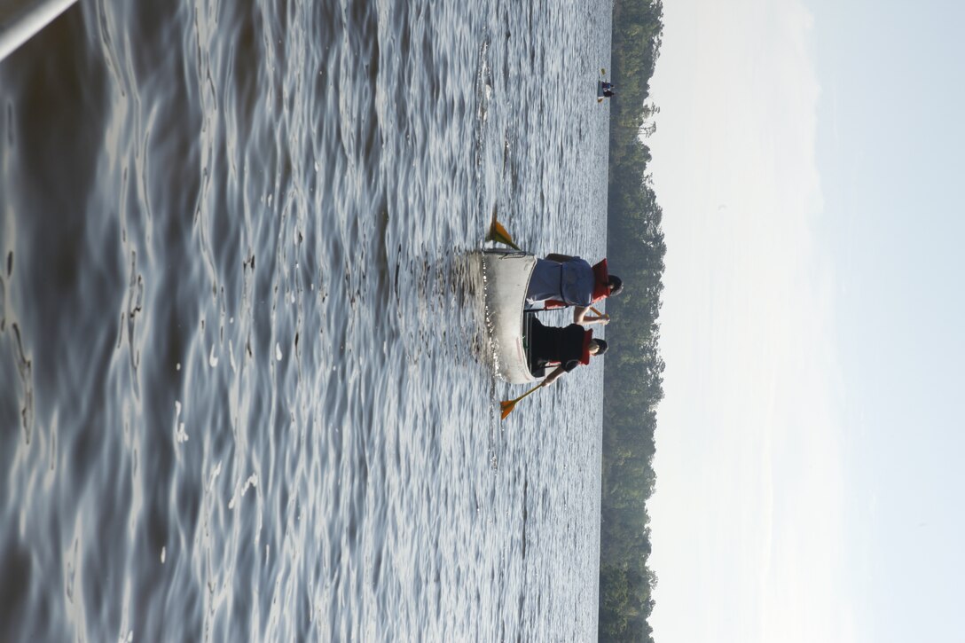 Volunteers head out in their canoes to pick up trash along the shorelines of Marine Corps Base Camp Lejeune during the Splash for Trash event held April 20 in celebration of Earth Day.