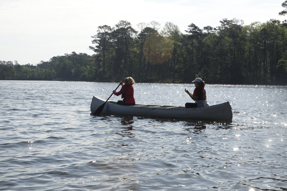 Volunteers head out in their canoes to pick up trash along the shorelines of Marine Corps Base Camp Lejeune during the Splash for Trash event held April 20 in celebration of Earth Day.