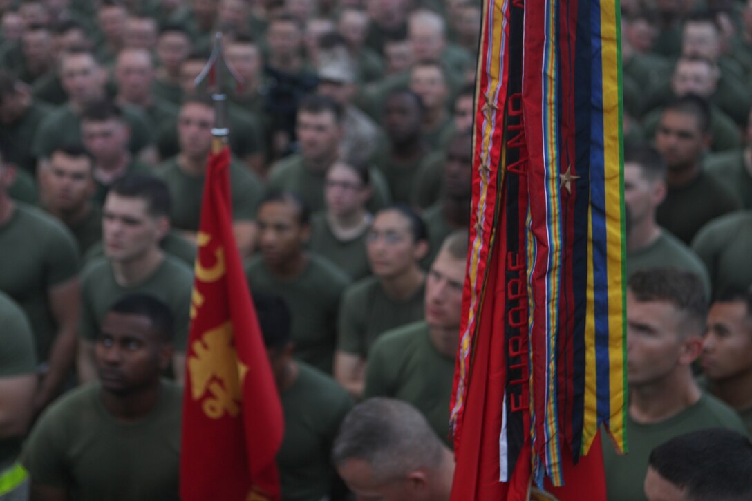 Battle streamers and unit guide-ons sit high over the Marines of the 2nd Marine Division as nearly 16,000 Marines listen to their commanding general, Maj. Gen. John A. Toolan, after a Division run aboard Marine Corps Base Camp Lejeune, N.C., April 20. (Official U.S. Marine Corps photo by Cpl. Timothy L. Solano)