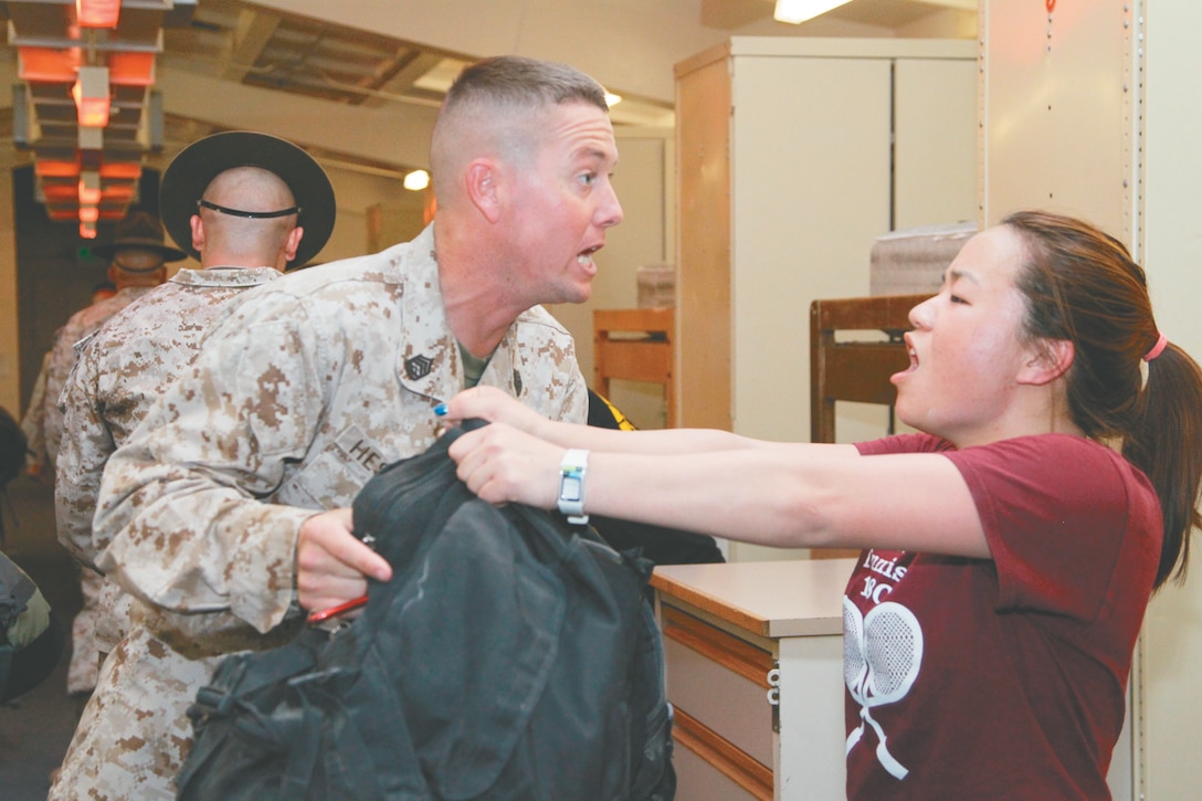 Gunnery Sgt. Benjamin Hester directs Ivana King, first-year student at the University of California Marshall School of Business, to “keep her bag up with elbows locked.” King was one of 17 students here with the Marshall Military Veterans Association 2012 Leadership Challenge April 20, 2012