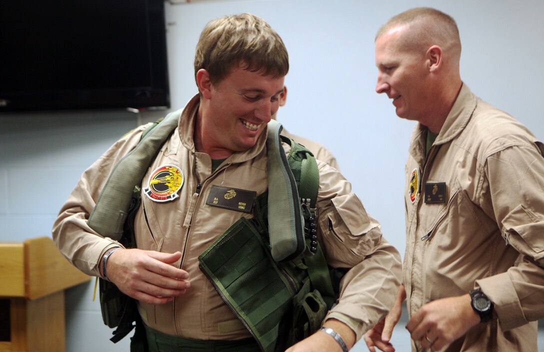 Medal of Honor recipient Sgt. Dakota L. Meyer is fitted in a flight suit April 20, aboard Kentucky Air National Guard Base. Meyer was being fitted in order to make sure he had a working suit before flying in a T/AV-8B Harrier during the Thunder Over Louisville air show April 21. Marine Attack Training Squadron 203 provided the harrier for Meyer to fly in during the air show.