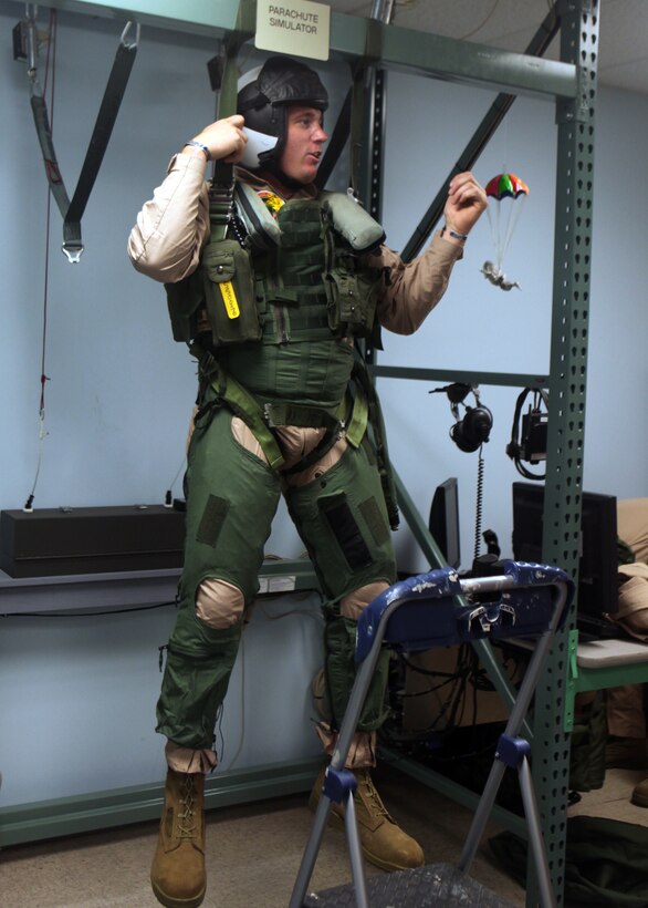 Medal of Honor recipient Sgt. Dakota L. Meyer tests his flight suit on a parachute simulator April 20 aboard Kentucky Air National Guard Base, before his flight on a T/AV-8B Harrier during the Thunder Over Louisville air show April 21. Marine Attack Training Squadron 203, based at Marine Corps Air Station Cherry Point, provided the harrier for the flight. “This is my first time ever flying in a harrier, but I’ve seen Top Gun about a dozen times,” said Meyer. “If Tom Cruise can handle flying a jet then I can too. I just hope I don’t throw-up.”