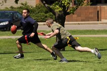 Recruiting Station Twin Cities logistics clerk Sgt. Sergio Lopez evades Sgt. John Treslley, a recruiter out of the Eau Claire, Wis., office, during an all-hands flag football game April 20. For additional imagery from the event, visit www.facebook.com/rstwincities.