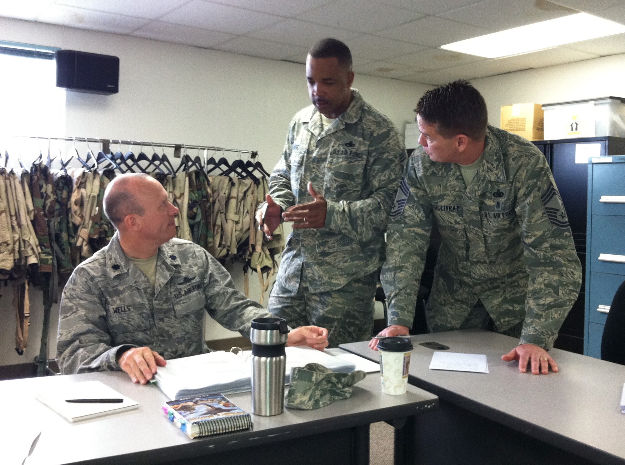 Lt. Col. Craig Wells (left), 349th Mission Support Group deputy commander;
Chief Master Sgt. Timothy C. White, Jr., 349th Aircraft Maintenance Squadron
superintendent; and Chief Master Sgt. Michael McGillivray, 349th Mission
Support Group superintendent, discuss challenges during table-top training
for the Crisis Action Team and the Wing Operations Center at Travis Air
Force Base, Calif., April 13, 2012. The training is in preparation for next
month's Operational Readiness Exercise.  (U.S. Air Force photo / Lt. Col.
Robert Couse-Baker)
