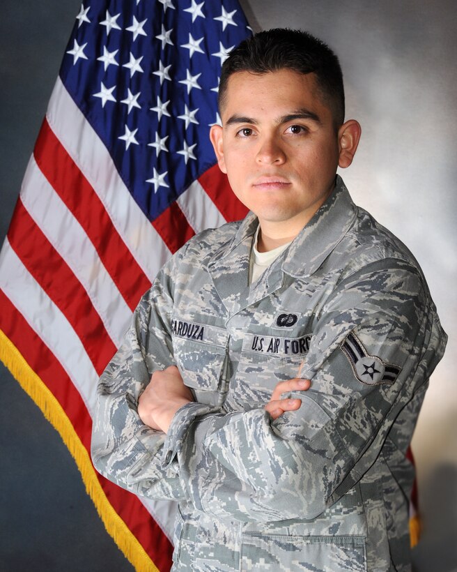 Airman 1st Class Abraham Garduza, a contracting specialist from the 92nd Contracting Squadron at Fairchild Air Force Base, Wash., fulfilled his dream of becoming an American Airman -- literally, March 27, 2012, when a Spokane, Wash., judge swore him in as a legal citizen. (U.S. Air Force photo by Senior Airman Benjamin Stratton)