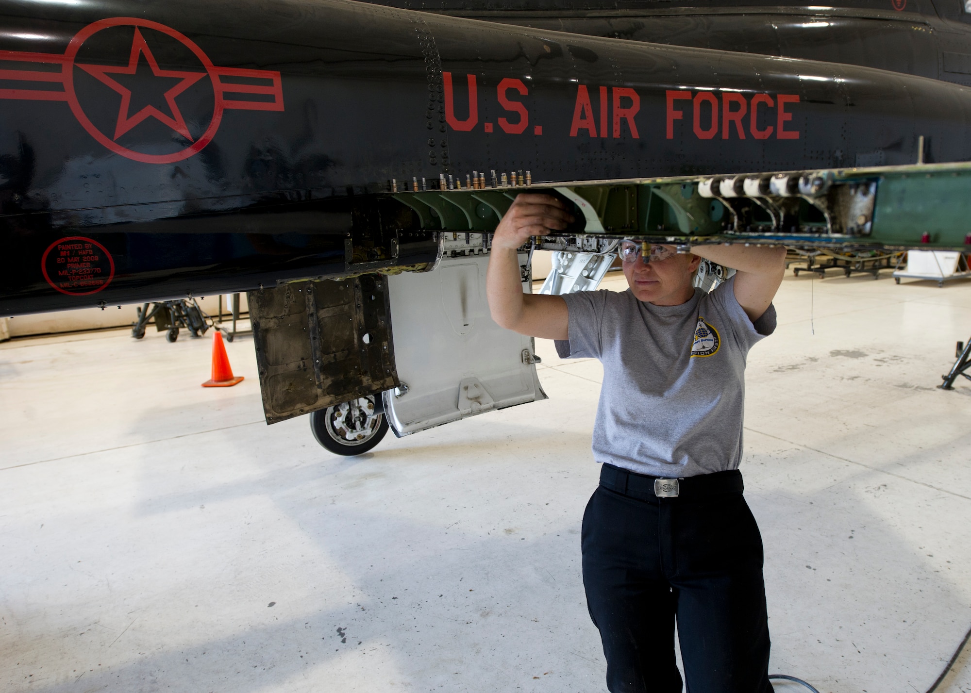 HOLLOMAN AIR FORCE BASE, N.M. – Tina McClane, an aircraft structural mechanic for the T-38 Talon, performs a spar replacement on a wing April 19. Small pieces of the aircraft such as the spar are constantly undergoing maintenance to ensure the aircrew can operate safely at all times. (U.S. Air Force photo by Daniel E. Liddicoet/Released)