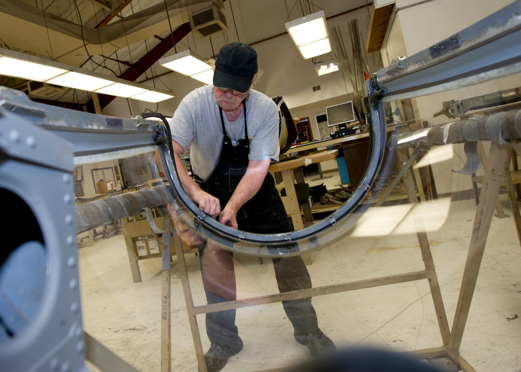 HOLLOMAN AIR FORCE BASE, N.M. – Larry Hilton, an aircraft sheet metal mechanic for the T-38 Talon, fastens the seal on an aft canopy April 19. Hilton’s continual maintenance of crucial parts like the canopy ensures that the aircrew of the T-38 are able to operate the aircraft safely at all times. (U.S. Air Force photo by Daniel E. Liddicoet/Released)