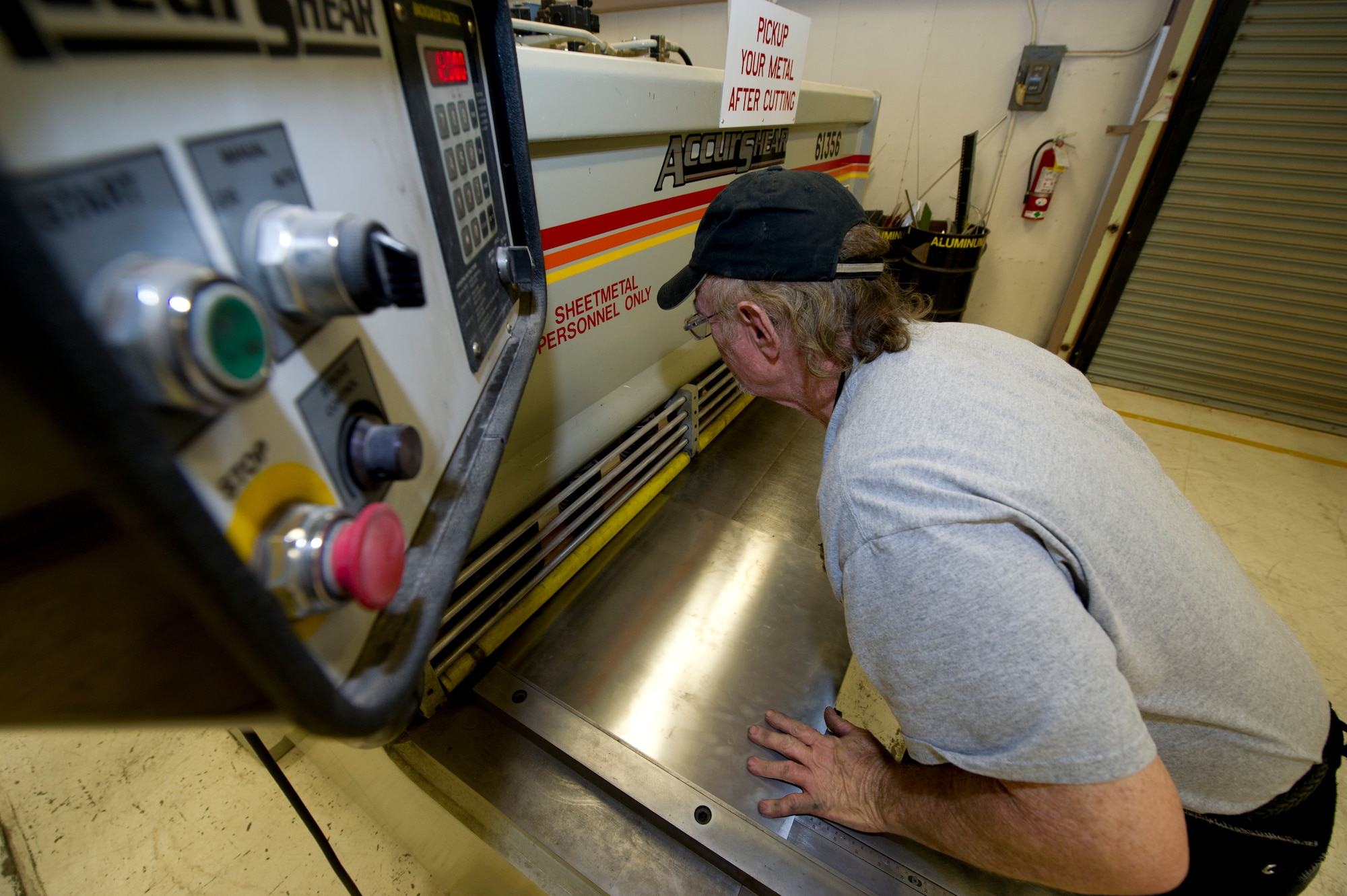 HOLLOMAN AIR FORCE BASE, N.M. – Larry Hilton, an aircraft sheet metal mechanic for the T-38 Talon, cuts a piece of sheet metal April 19. As a sheet metal mechanic, Hilton is responsible for the maintenance and repair of a wide array of critical parts to the T-38. (U.S. Air Force photo by Daniel E. Liddicoet/Released)