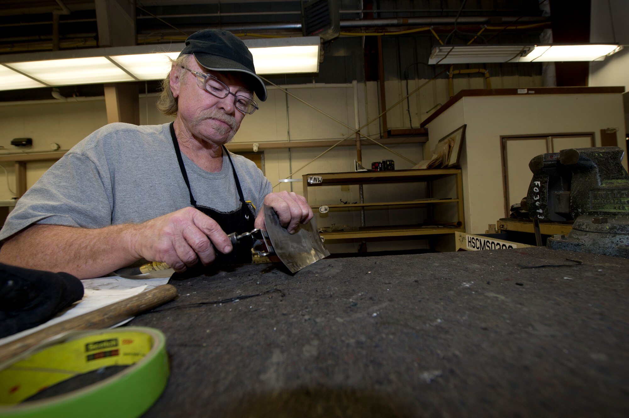 HOLLOMAN AIR FORCE BASE, N.M. – Larry Hilton, an aircraft sheet metal mechanic for the T-38 Talon, repairs an outer-engine leaf April 19. The outer-engine leaf is primarily responsible for deflecting exhaust from the engine. Hilton’s maintenance of critical pieces such as the outer-engine leaf is fundamental in the T-38’s ability to operate. (U.S. Air Force photo by Daniel E. Liddicoet/Released)