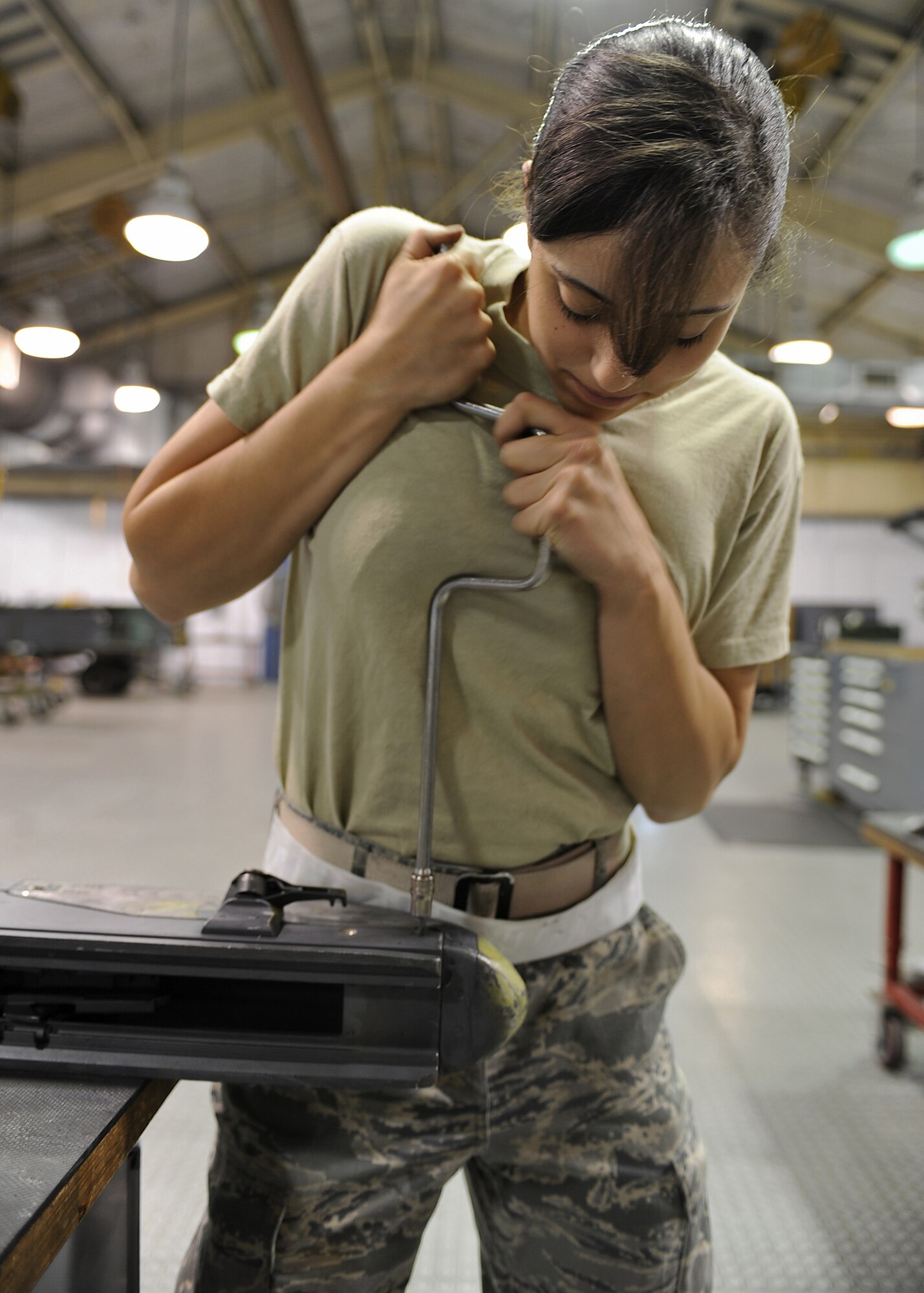 U.S. Air Force Airman 1st Class Katrina Bonenfant removes a shoulder screw on a launcher adapter unit 128 at the armament shop on Seymour Johnson Air Force Base, N.C., April 19, 2012. The LAU-128 missile launcher attaches to the F-15E Strike Eagle and is capable of firing advanced medium-range air-to-air missiles 120 and 9. Bonenfant, 4th Equipment Maintenance Squadron aircraft armament systems journeyman, is a native of Orange, Mass. (U.S. Air Force photo/Airman 1st Class John Nieves Camacho/Released)