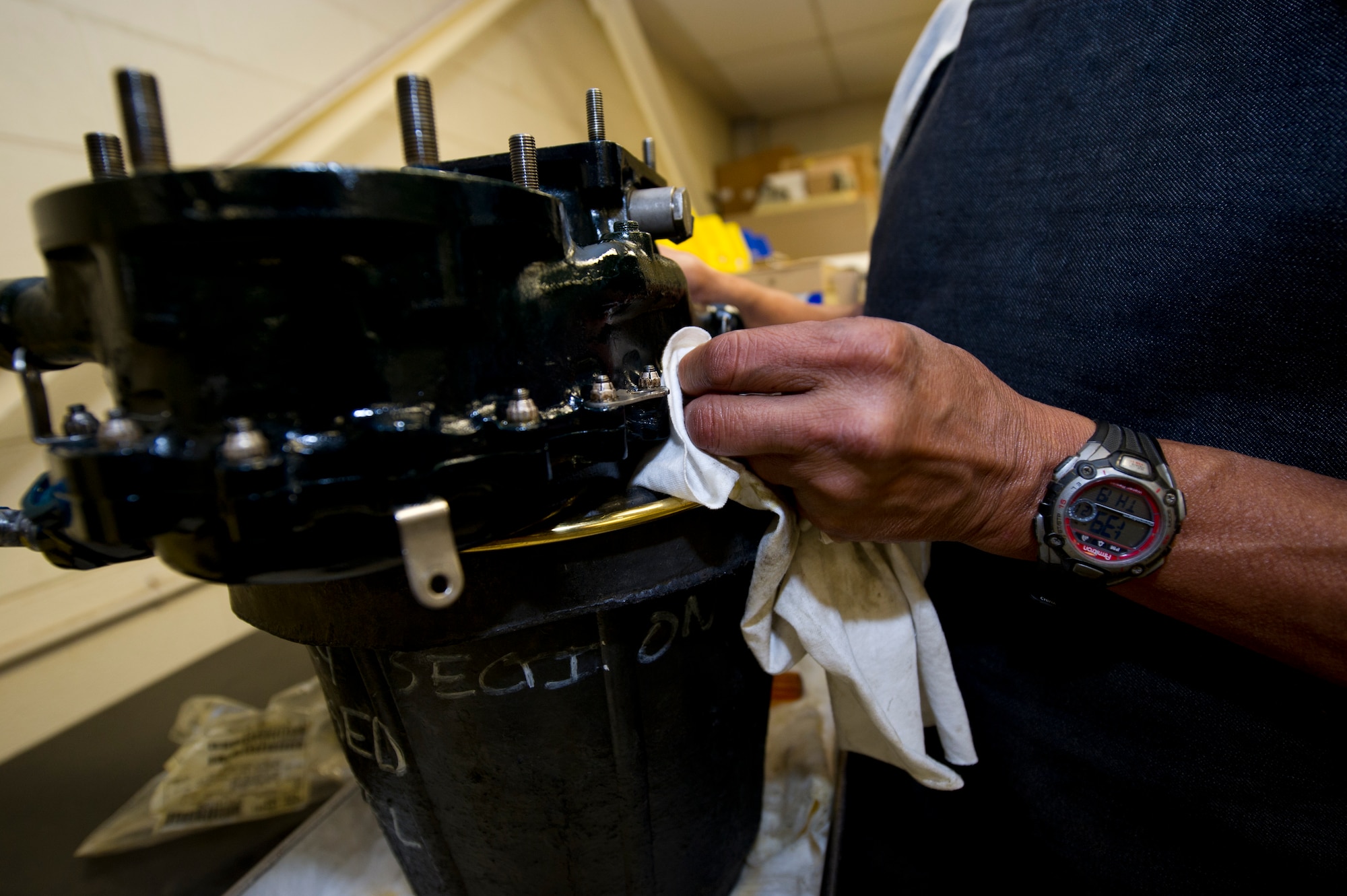 HOLLOMAN AIR FORCE BASE, N.M. – Bobby Aguilar, an aircraft engine mechanic for the T-38 Talon, cleans an engine-mounting gear box on the J85 jet engine April 19. Aguilar works in the accessories section of the T-38 engine shop. His job is to clean and prepare specific parts for reassembly. (U.S. Air Force photo by Daniel E. Liddicoet/Released)