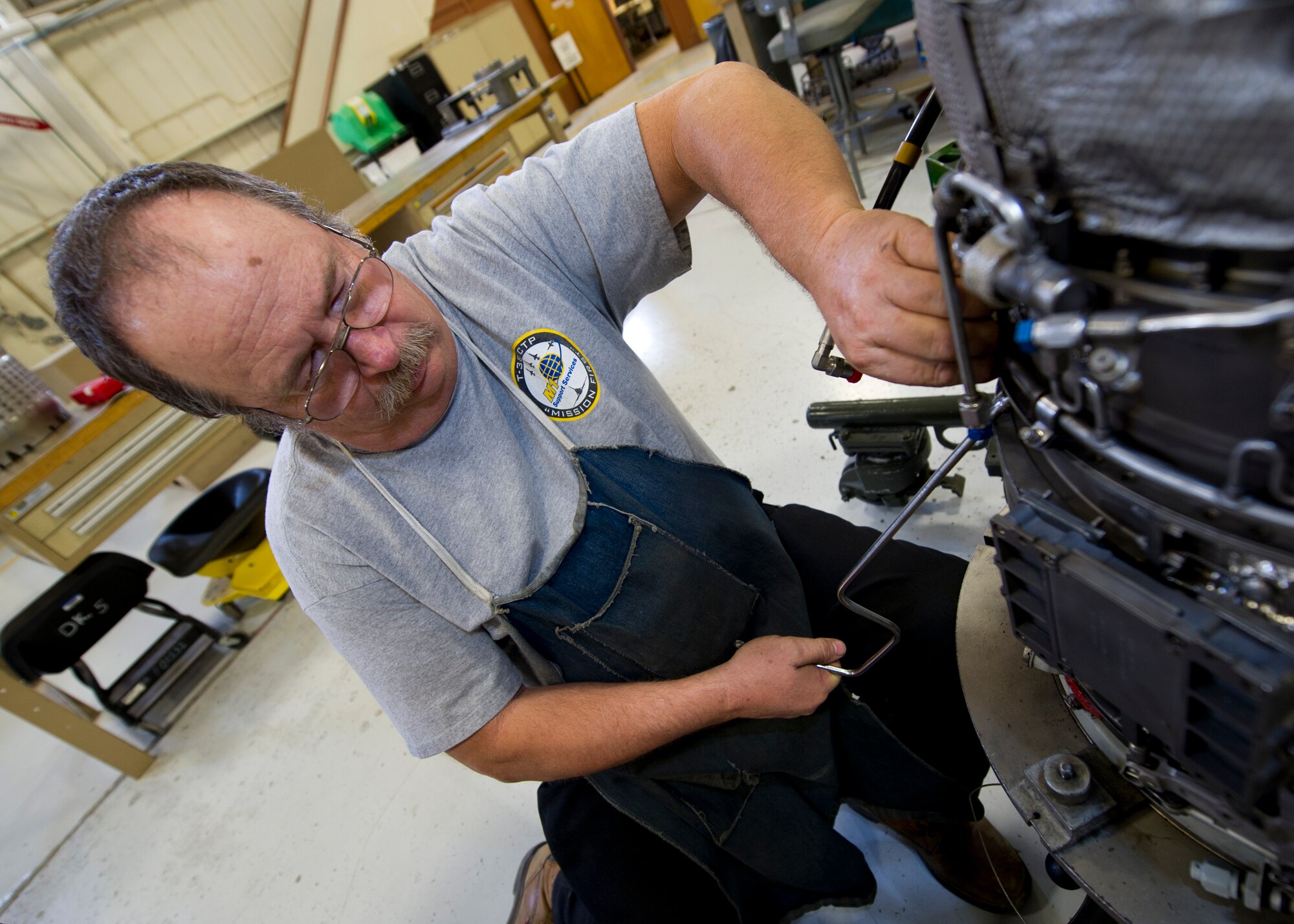 HOLLOMAN AIR FORCE BASE, N.M. – Bill Hyde, an aircraft engine mechanic for the T-38 Talon, re-builds a J85 jet engine April 19. The J85 is a small, single-shaft turbojet engine capable of producing up to 3,000 pounds of thrust. The engine is lightweight and cost-efficient, making it ideal for training at Holloman AFB. (U.S. Air Force photo by Daniel E. Liddicoet/Released)