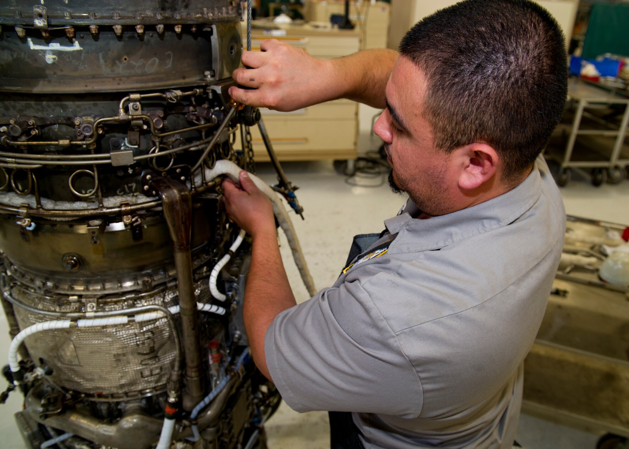 HOLLOMAN AIR FORCE BASE, N.M. – John Segovia, an aircraft engine mechanic for the T-38 Talon, tears down a J85 jet engine April 19. The J85 is one of the longest military jet engines in service with more than 16.5 million hours of operation.  It is still heavily relied on to complete the T-38’s training mission at Holloman AFB. (U.S. Air Force photo by Daniel E. Liddicoet/Released)