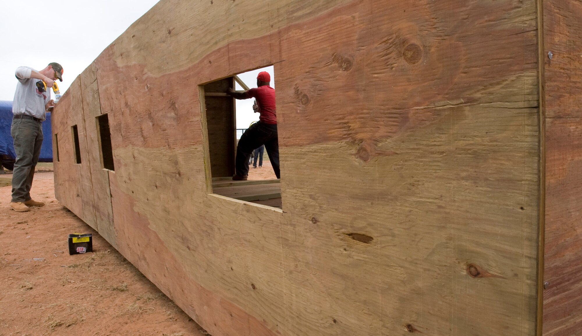 Tech. Sgt. Joshua Hallmark and Staff Sgt. Santana Brown, 28th Civil Engineer Squadron structures craftsmen, build a new temporary shelter for the animals at the Battle Mountain Humane Society in Hot Springs, S.D., April 13, 2012. The Battle Mountain Humane Society, a privately-owned, no-kill shelter for animals, has been taking in and caring for animals for the last five years.  (U.S. Air Force photo by Airman 1st Class Anania Tekurio/Released)