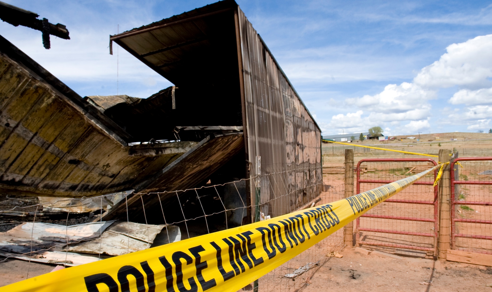 Police tape marks the perimeter of the Battle Mountain Humane Society that burned down in Hot Springs S.D., April 13,2012. Eleven dogs died in the fire at the privately-owned animal shelter which has been operating for the last five years. (U.S. Air Force photo by Airman 1st Class Anania Tekurio/Released)