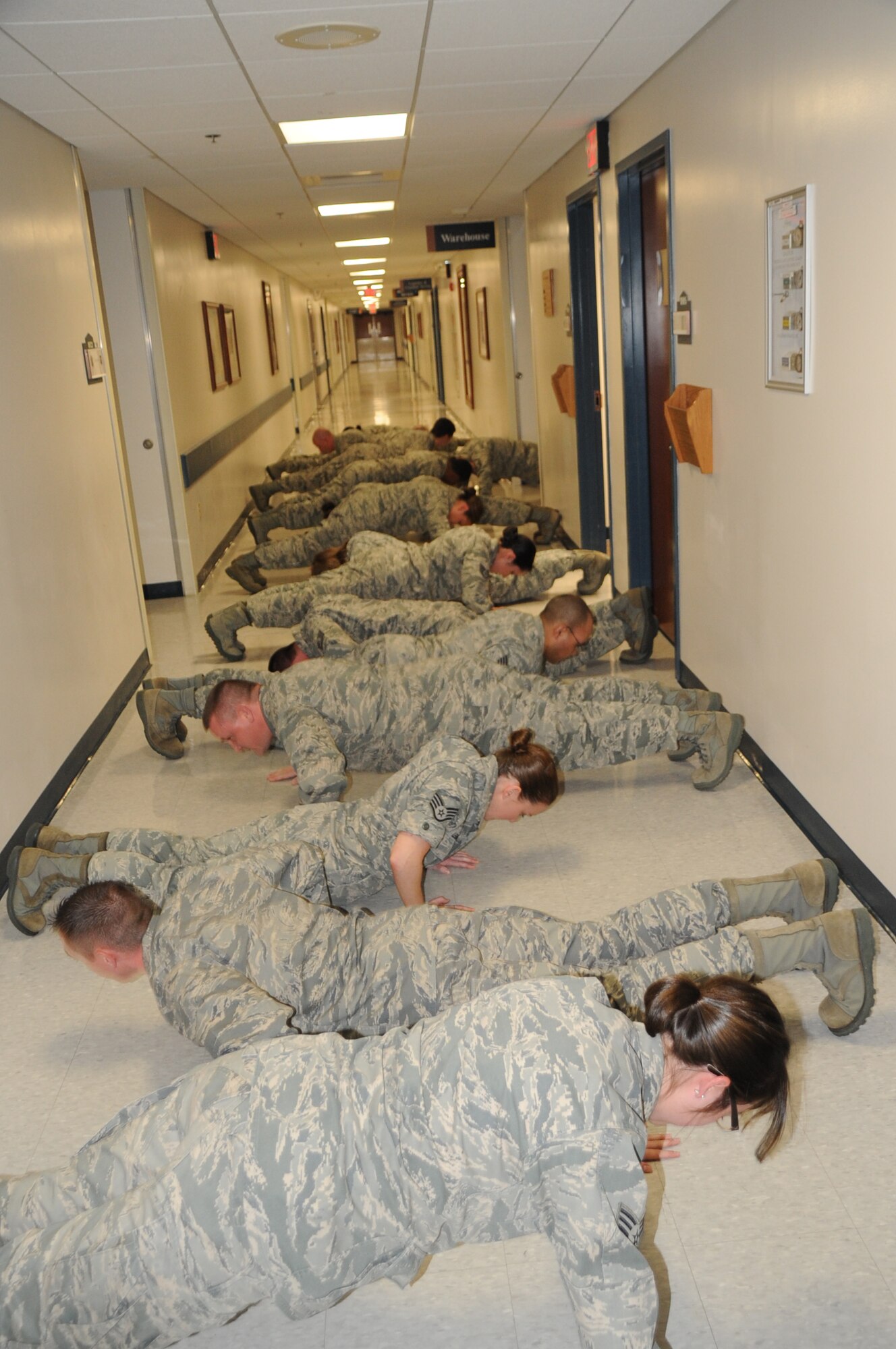 Striving to reach one million pushups before the end of the fiscal year, 17 service members of the 87th Medical Support Squadron here, crank out another 40 pushup bringing the total to 430,000. (U.S. Air Force Photo by Pascual Flores/Released)