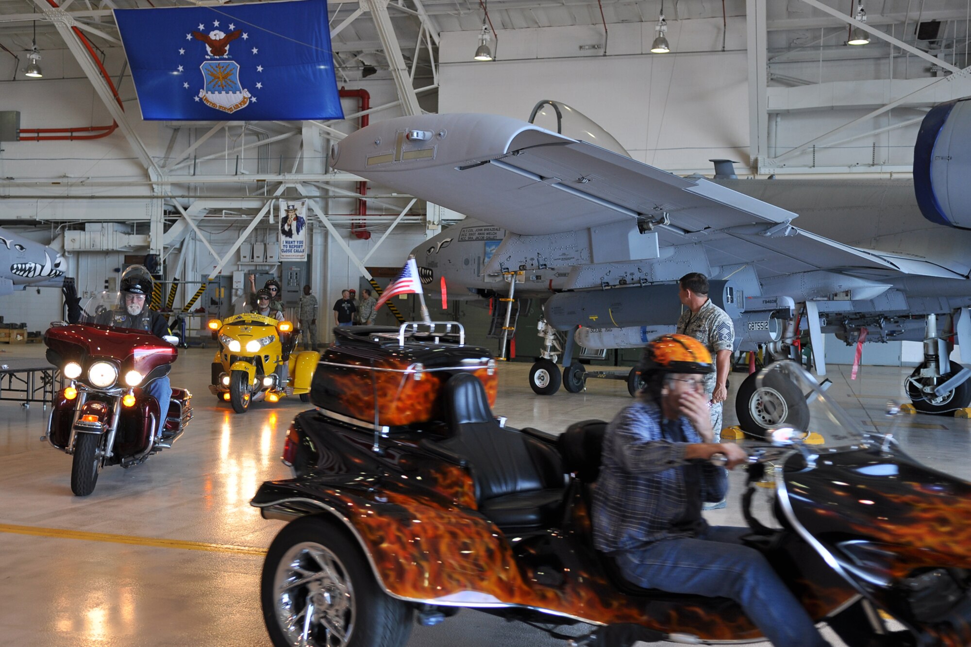 Members of the Patriot Guard Riders file out of the A-10 Hangar at Barksdale Air Force Base, La., April 17, 2012. The Patriot Guard Riders is a diverse amalgamation of riders from across the nation who have an unwavering respect for those who risk their lives for America’s freedom and security. (U.S. Air Force photo by Betty Stephens)  